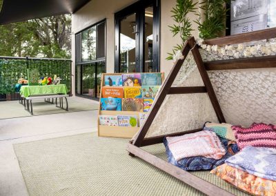 Mitchelton childcare worker celebrating with child